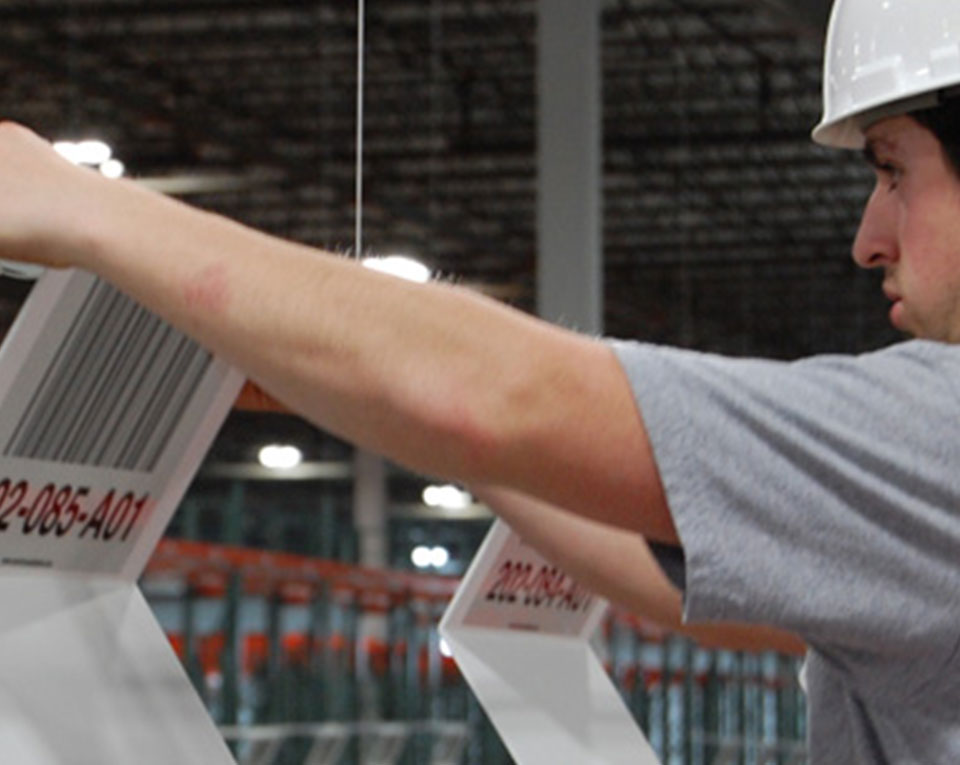 Man looking at labels