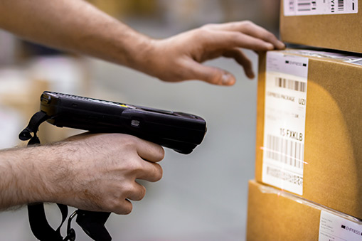 Man scanning box for shipping