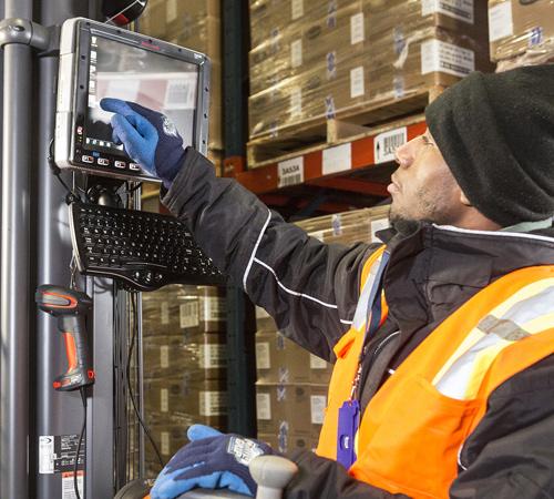 Warehouse worker using Honeywell products.
