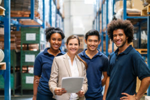 Warehouse workers together for a group picture